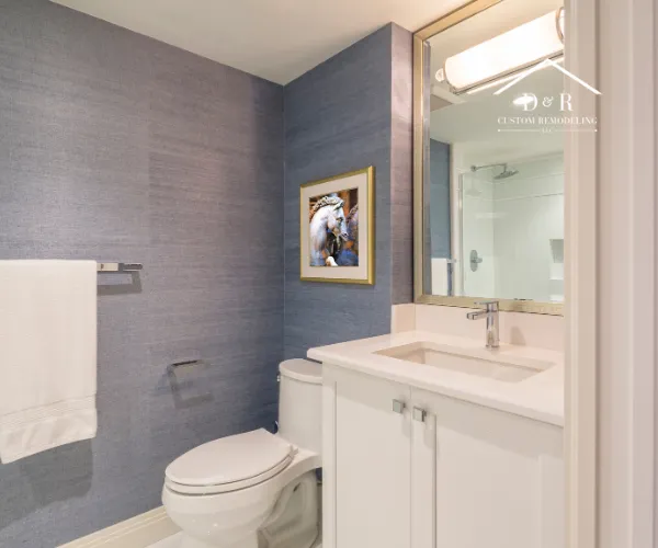 A walk-in shower interior with vertical gray subway tiles on the back wall