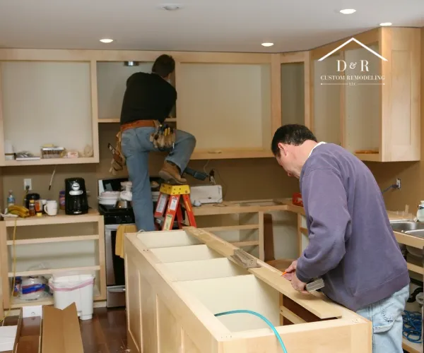 A bright kitchen with light wood lower cabinets