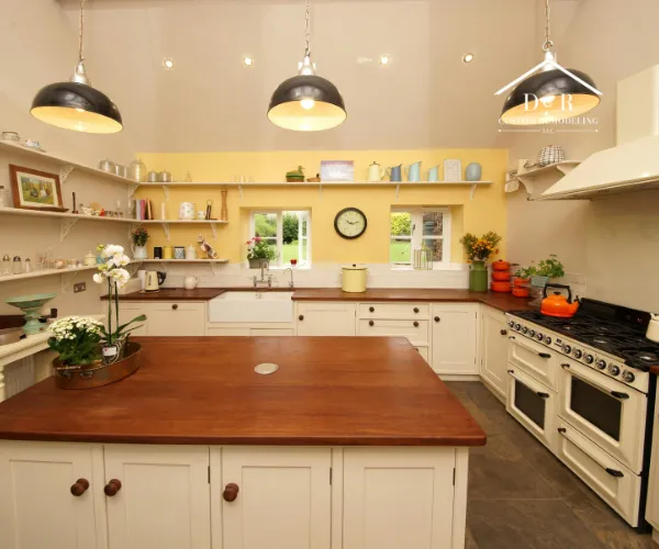 A modern kitchen featuring white cabinetry