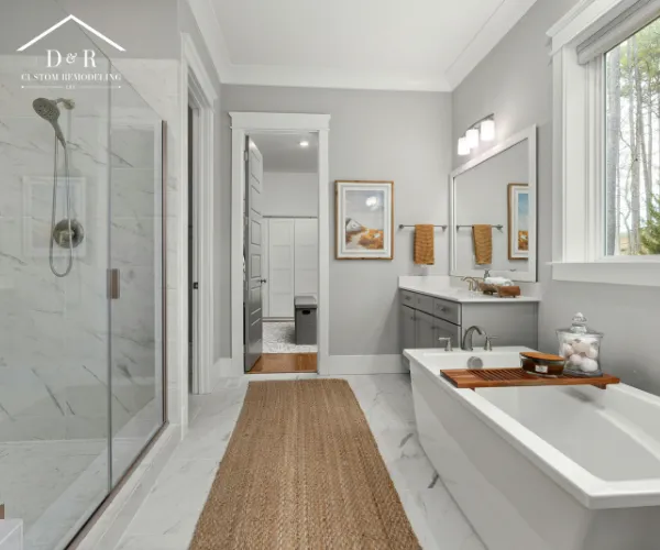 bathroom remodeling in Austin TX A beautifully remodeled modern bathroom featuring a spacious walk-in shower with floor-to-ceiling marble tiling.