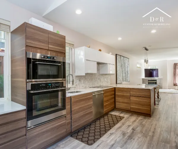 A newly remodeled open-concept kitchen featuring modern wood-grain cabinetry.