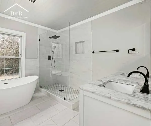 bathroom remodeling in Austin A bright bathroom design with a freestanding white tub next to a window
