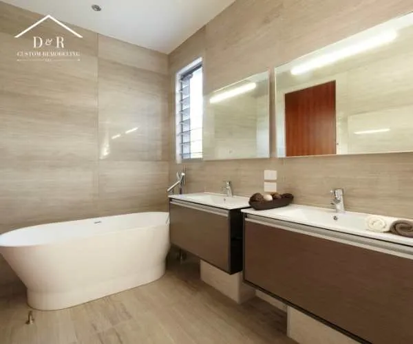 A modern bathroom with light beige wall and floor tiles