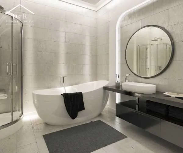 A bright bathroom design with a freestanding white tub next to a window