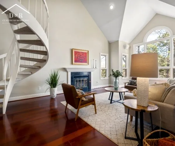 High-ceiling living room with a white spiral staircase, dark hardwood floors, a fireplace, and mid-century modern seating.